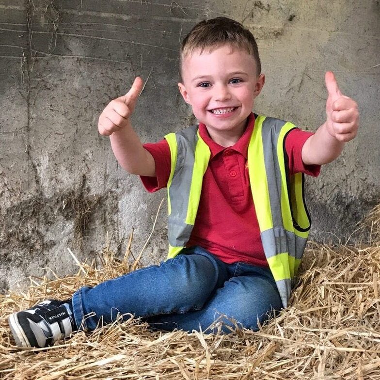 Thumbs up from Jack our young guest after his cuddle time experience at Blackstone Farm